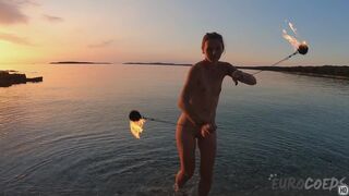 Hot Ginger Professional Fire Dancer Lea Playing With Her Flames On The Beach During Sunset