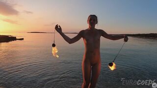 Hot Ginger Professional Fire Dancer Lea Playing With Her Flames On The Beach During Sunset