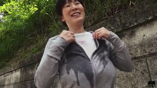 Sweaty older Japanese woman with massive tits uses them on my feet