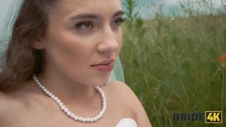 BRIDE4K. Pretty brunette bride fucks a horny shepherd in a summer field