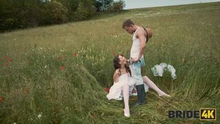 BRIDE4K. Pretty brunette bride fucks a horny shepherd in a summer field